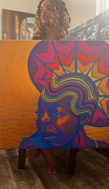 A photo of the artist, Erin Smith Glenn (Erin M Smith), with The HAIRitage of Nina Simone. Art and mental health. The importance of black mental health and black history. In Black history month and beyond. Simone was neurodivergent and likely bipolar. 

Erin was published in The Shallot.
